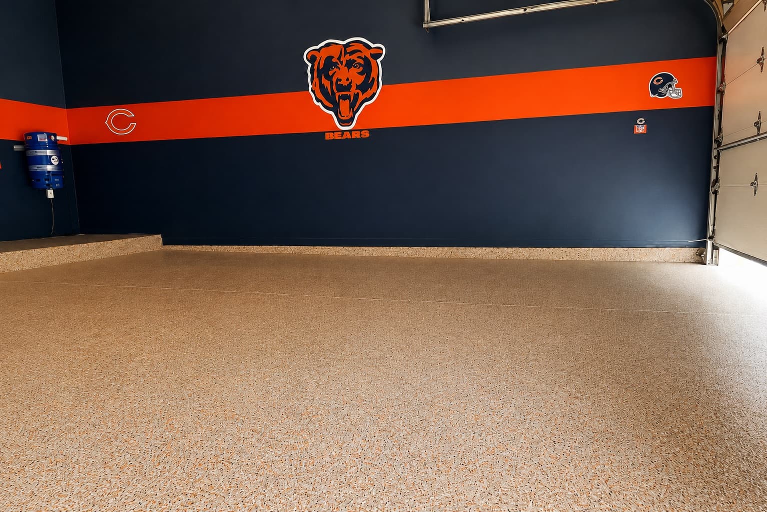 Finished tan full-flake garage floor coating with a custom Chicago Bears wall